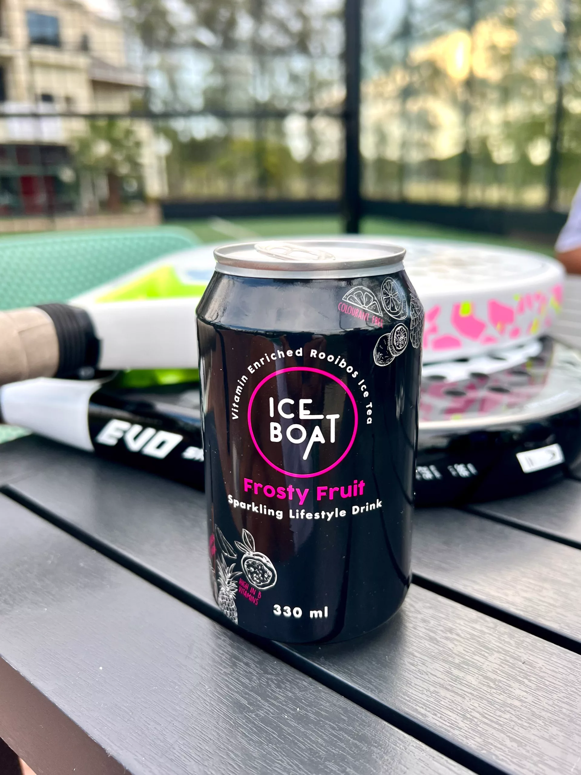 An Ice tea Ice Boat Tin at a padel game